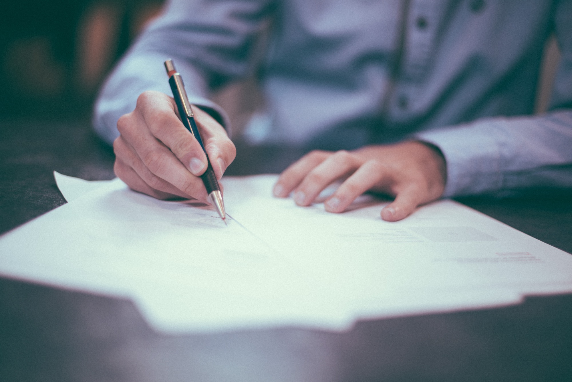 Man signing a loan